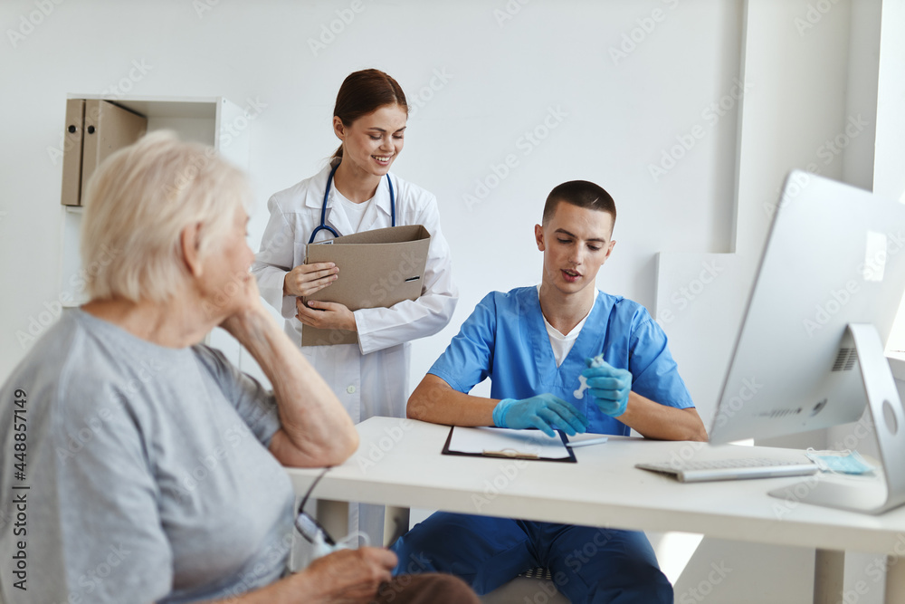 elderly woman patient doctor assistant in hospital elderly woman patient doctor assistant in hospital