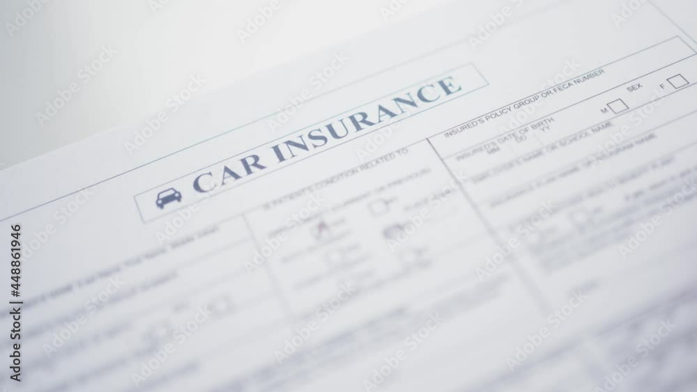 Filling a Car Insurance Document By Hand Closeup Filling a Car Insurance Document By Hand Closeup