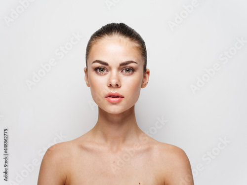 drink beautiful young woman on a light background naked shoulders cropped view © SHOTPRIME STUDIO