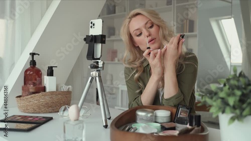 Attractive young woman vlogging about make up and beauty products 