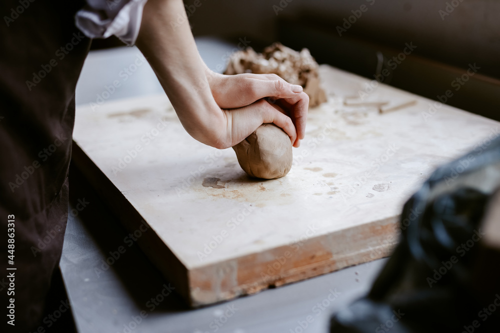 Artist working in pottery studio Artist working in pottery studio