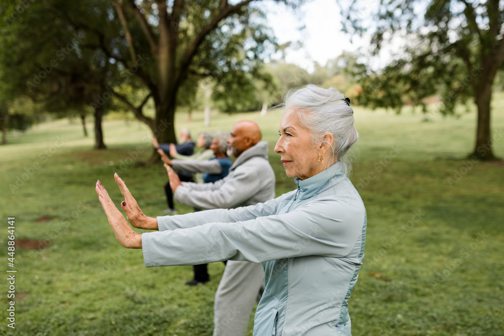 © McKinsey Jordan/Stocksy - Seniors Look Serious During Workout in the Park