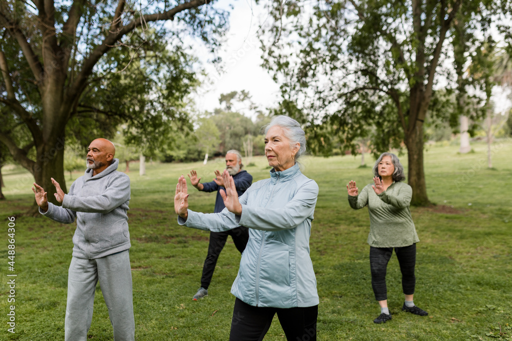 © McKinsey Jordan/Stocksy - Seniors Engage in a Martial Arts Workout in the Park