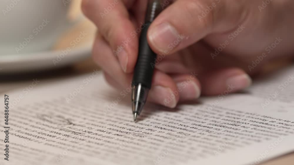 Teacher Making Correction Marks on a Text