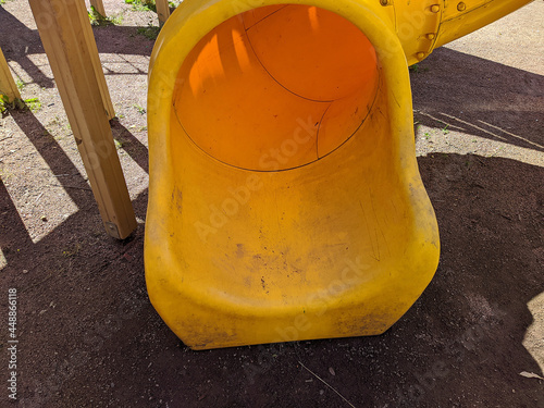 dirty and broken kids plastic slides closeup photo.