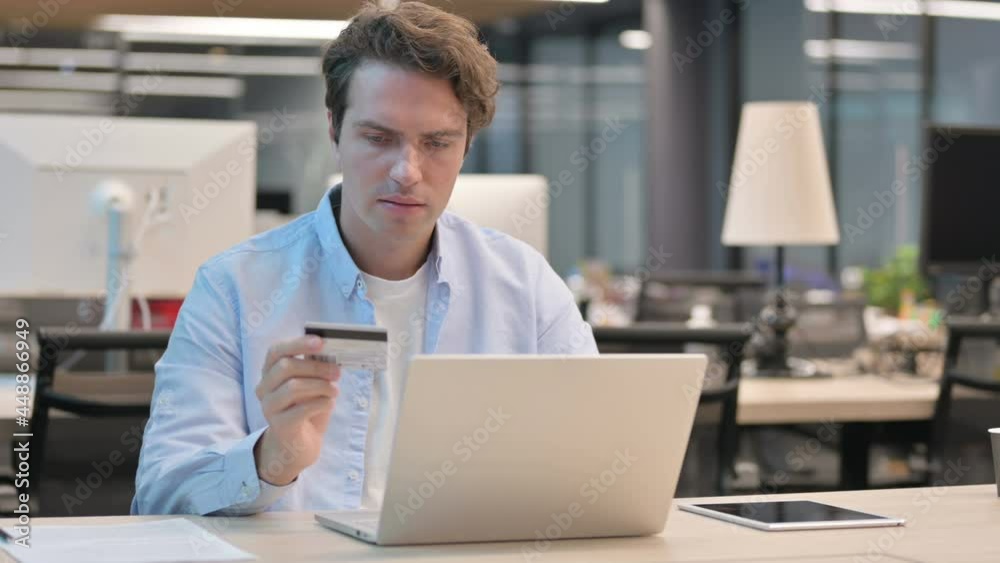 Man making Online Payment Failure on Laptop in Office Man making Online Payment Failure on Laptop in Office