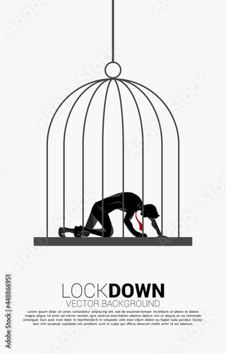 silhouette of businessman on knee in big bird cage. Concept for workplace stress and depress people.