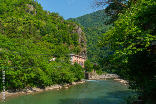 BATUMI, GEORGIA: Stone arch bridge of Queen Tamara near the Adjaristskali River on a sunny summer day.