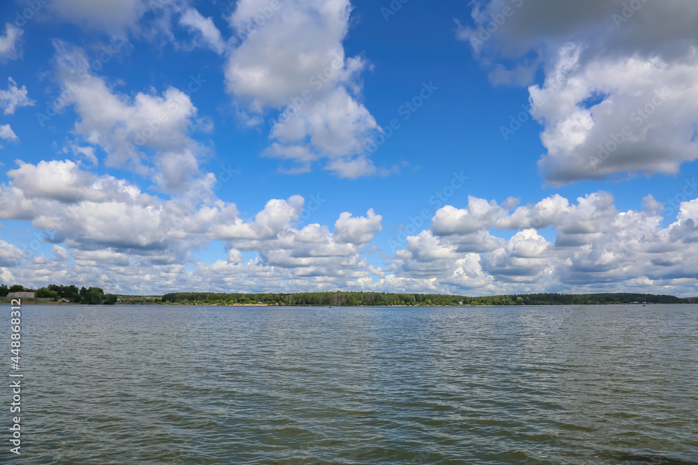 Obraz premium Beautiful natural summer landscape with picturesque lake Senezh and cloudy sky. Moscow region, Russia
