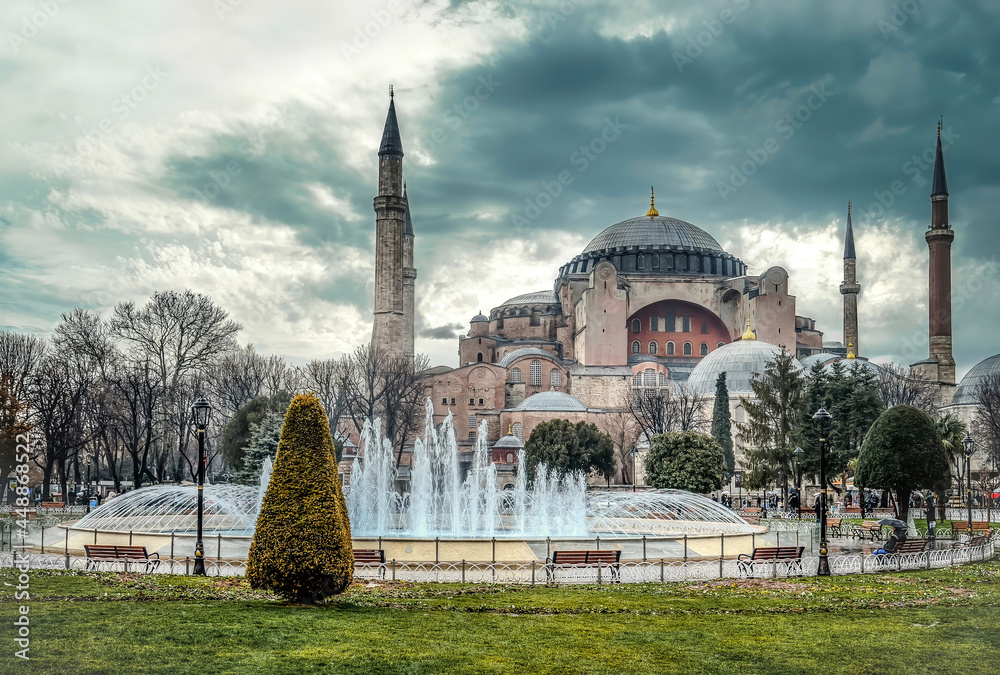 Istanbul, Turkey - January 12, 2013: Hagia Sophia mosque dome and minarets in Sultanahmet square under dramatic clouds