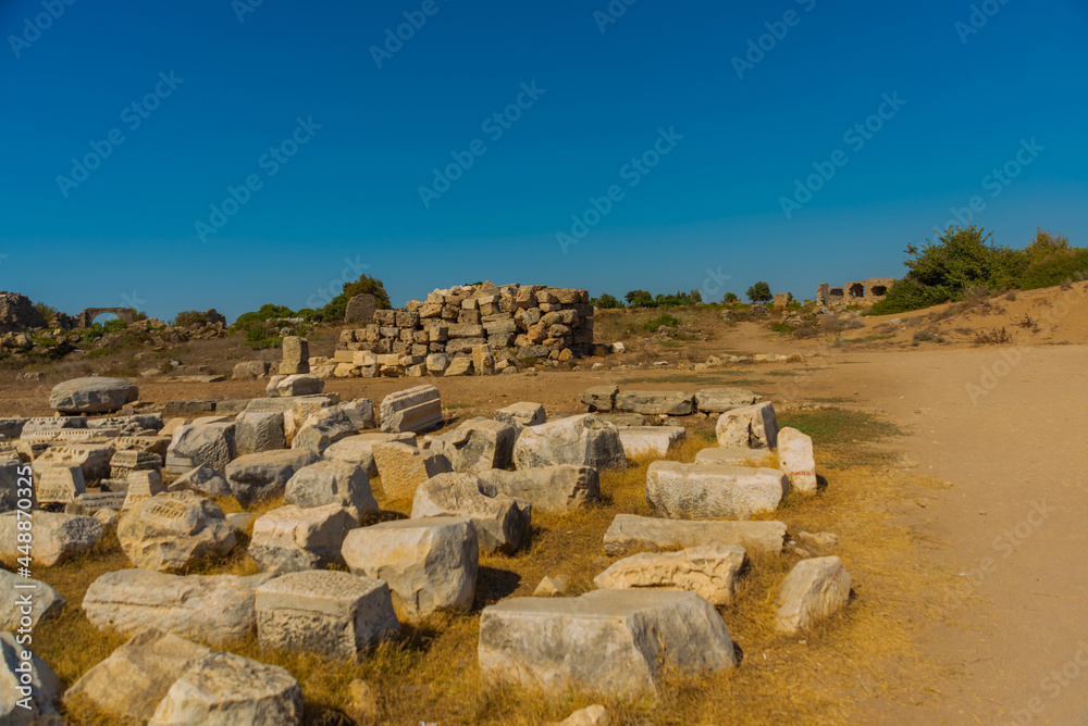 SIDE, TURKEY: Ancient ruins and a road in the city of Side on a sunny summer day.