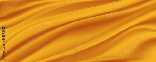gold satin or silk fabric as background.Yellow silk or satin luxury fabric texture can use as abstract background.