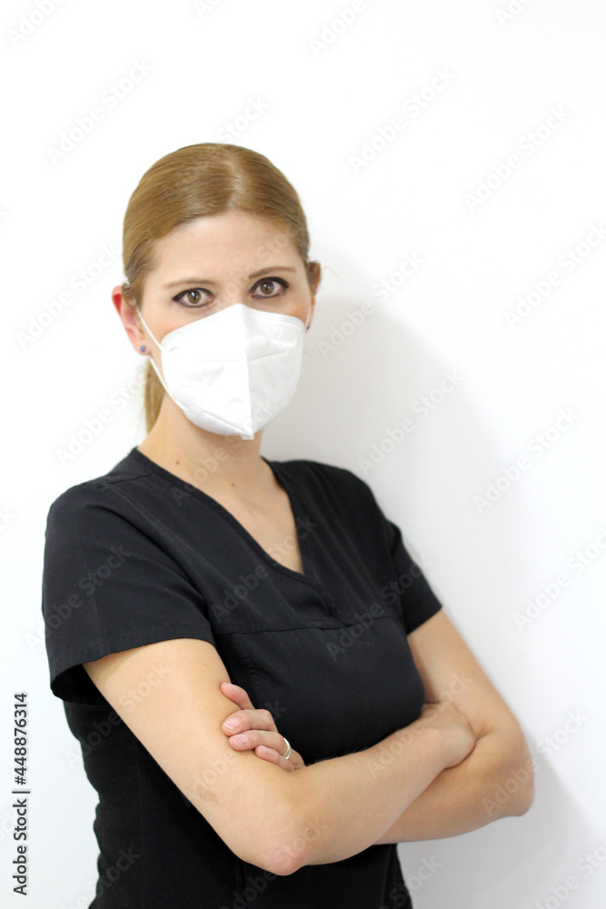 Woman specialist professional doctor with white coat and face mask ready to fight against Covid-19 or Coronavirus
