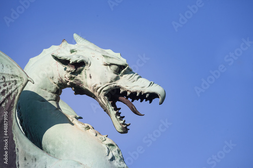 Close up on Dragon statue on zmajski most, or zmajev most (Dragon bridge) in Ljubljana, capital city of Slovenia from the late 19th century. The dragon is the symbol of the city, protecting it photo