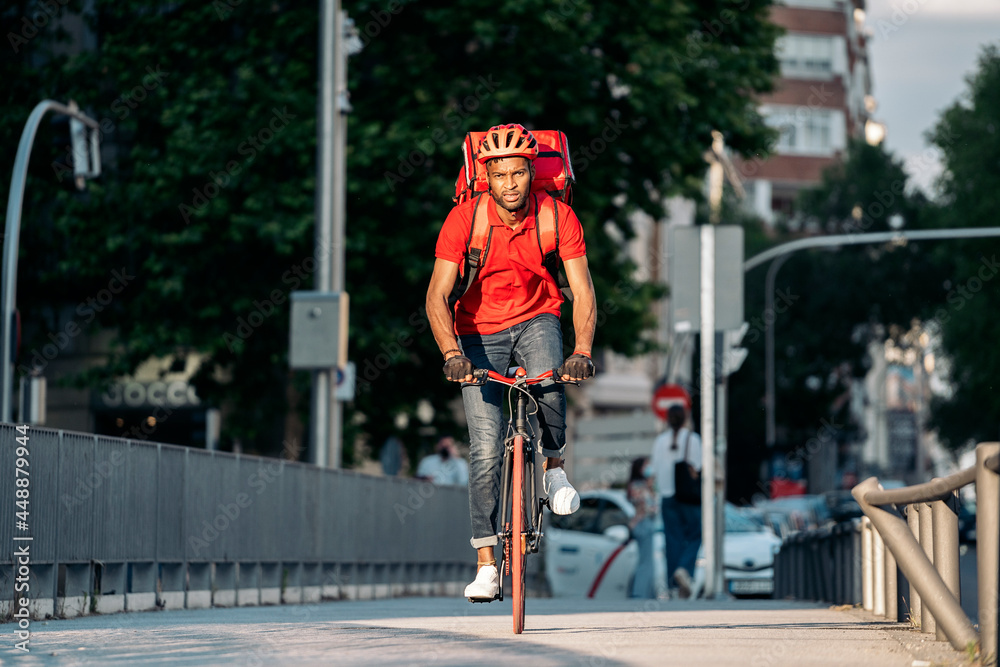 African Delivery Man Riding Bike African Delivery Man Riding Bike