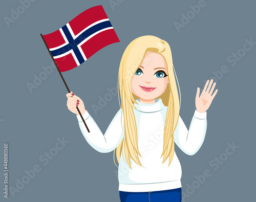 Beautiful long haired blonde Norwegian woman waving Norway flag and saluting with hand