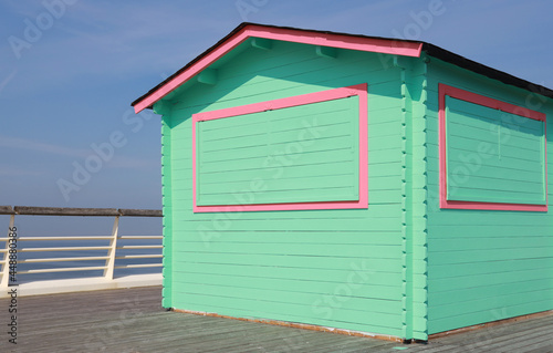 green wooden hut on pier photo