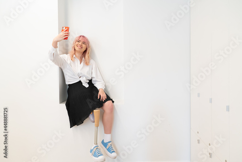 Woman With Leg Disability Doing Selfie