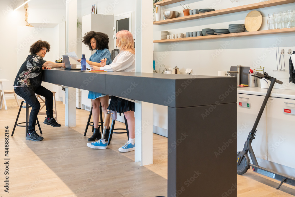 © Hernandez & Sorokina/Stocksy - People At Modern Co-working Kitchen © Hernandez & Sorokina/Stocksy - People At Modern Co-working Kitchen