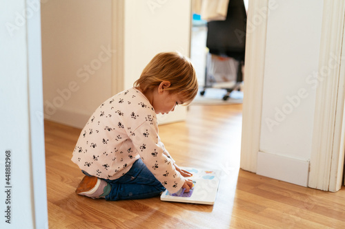 A Kid Reads a Book into the Hall