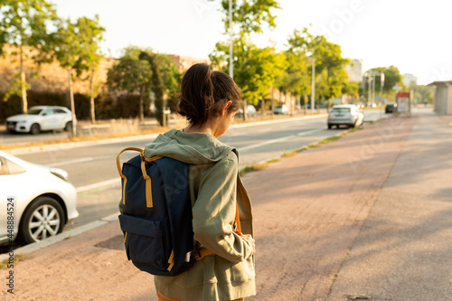 Girl after school walking down the street