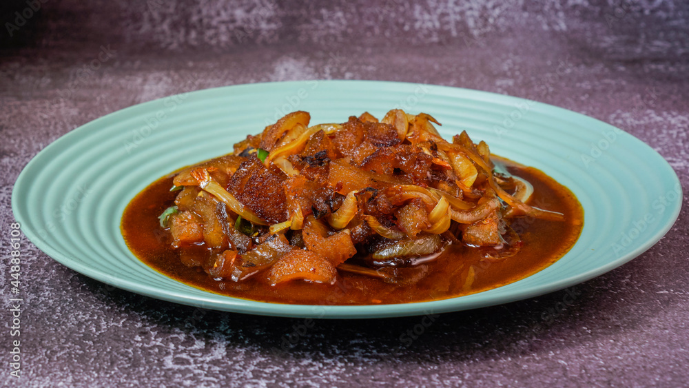 Stir fry cow skin with spicy soy sauce. Stir fry cow skin with spicy soy sauce.