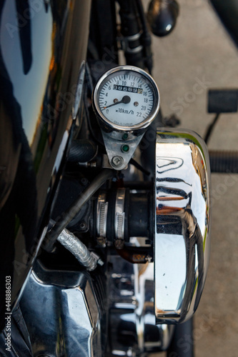 Speedometer on side of retro motorcycle photo