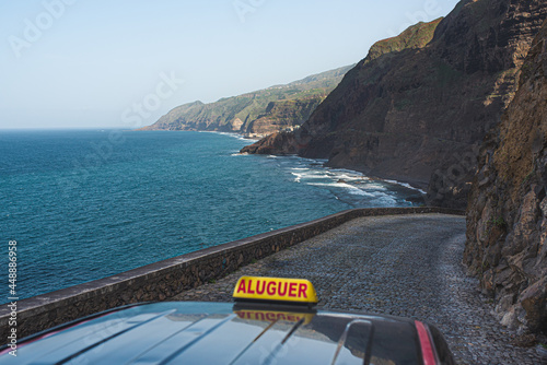 Taxi car driving on picturesque mountain road photo