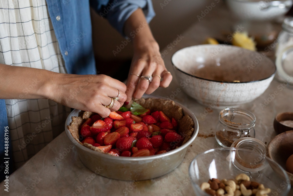 Anonymous Woman Cutting Strawberry For A Cake Anonymous Woman Cutting Strawberry For A Cake