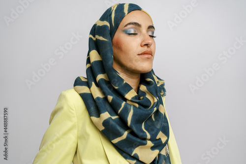 Elegant muslim woman in hijab with makeup photo