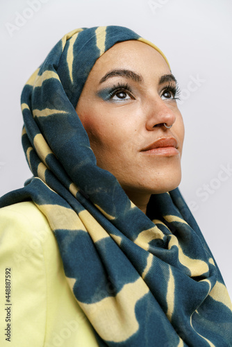 Elegant muslim woman in hijab with makeup photo