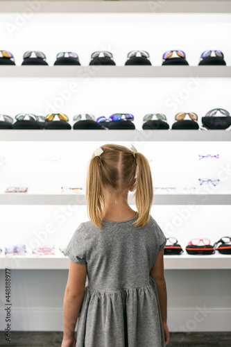 Eyewear: Girl Looks At Modern Glasses