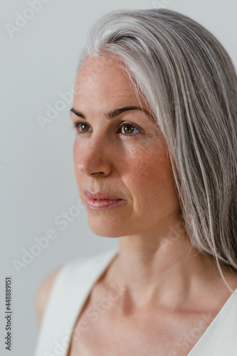 Serious middle aged woman with gray hair