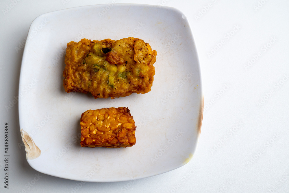 Tempe is a traditional Indonesian dish made from soybeans, fried with flour or without