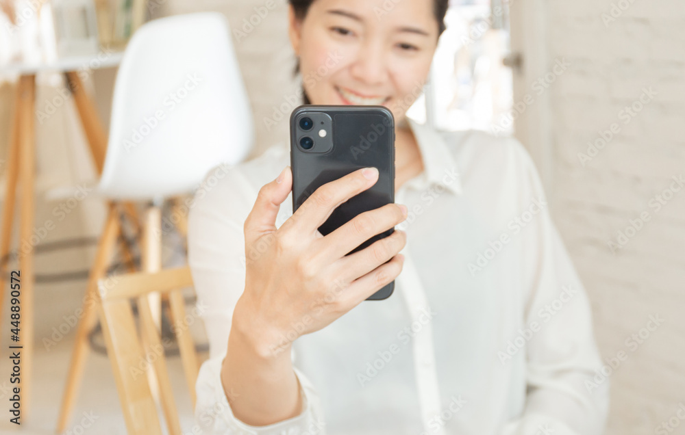 woman work using cell phone hand holding mobile texting message contact us.chatting,search internet information in office.technology device communication connecting woman work using cell phone hand holding mobile texting message contact us.chatting,search internet information in office.technology device communication connecting
