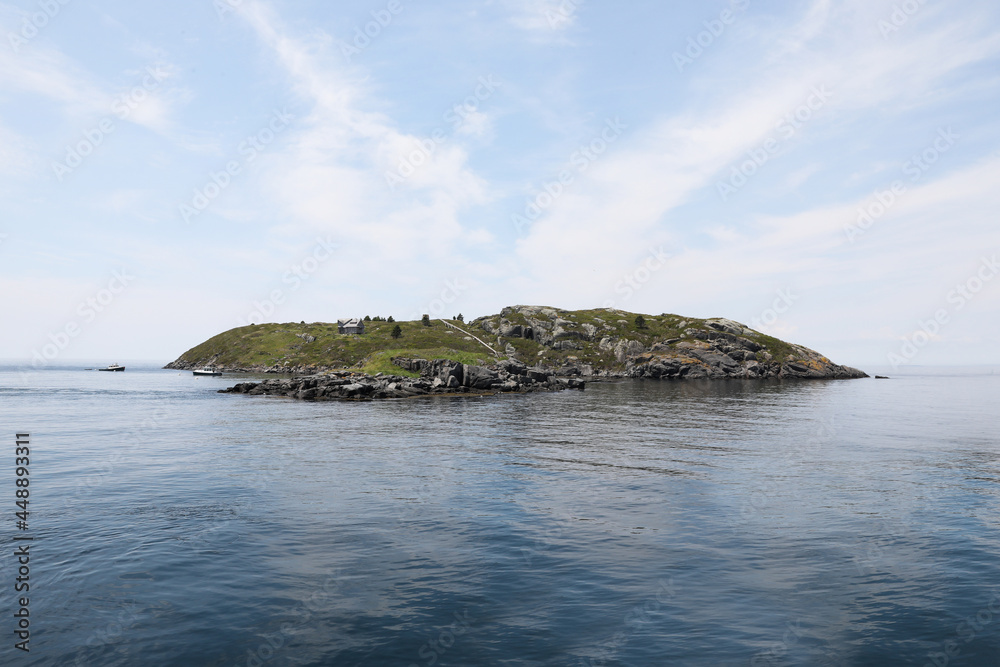 View of a distant island in the ocean View of a distant island in the ocean