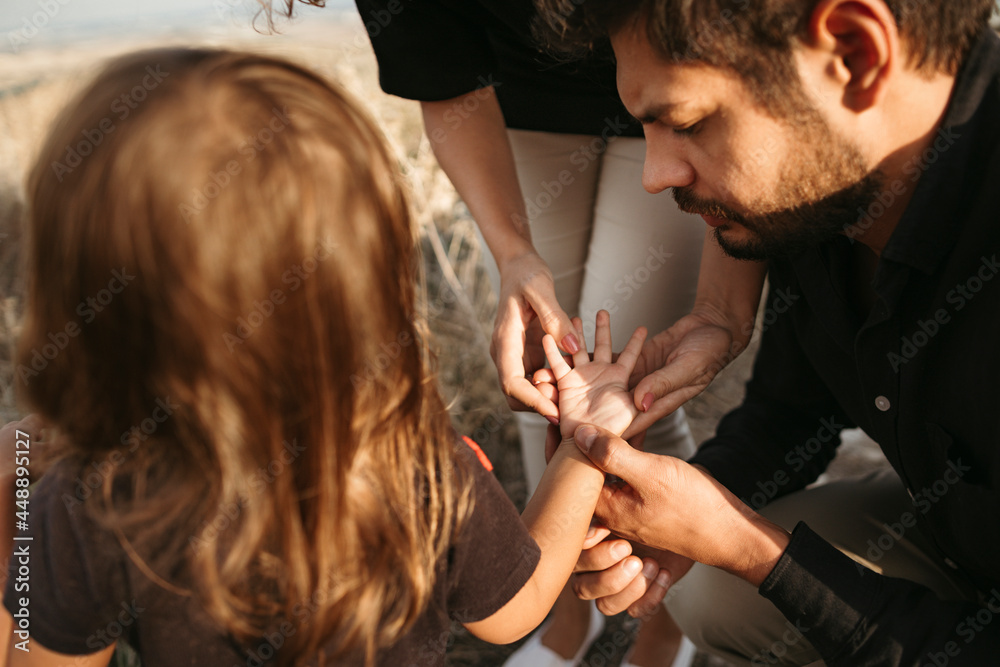 © Irina Polonina/Stocksy - A family with a little daughter on a walk. © Irina Polonina/Stocksy - A family with a little daughter on a walk.