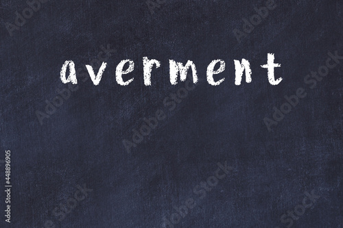 College chalk desk with the word averment written on in photo