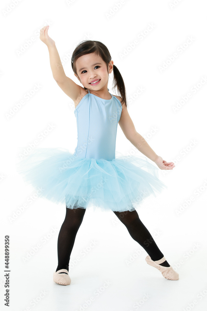 Fototapeta premium Portrait isolated studio shot of small beautiful Asian kindergarten pigtails ballerina dancer girl in blue tutu ballet dress black legging standing posing in cute gestures
