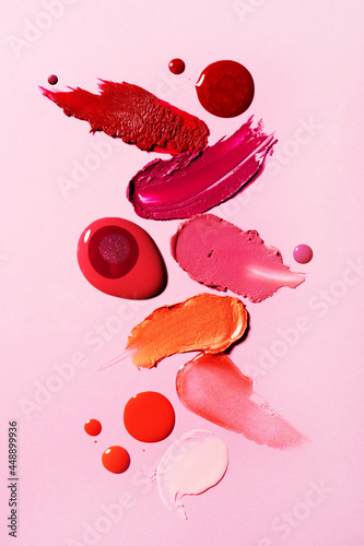 Red and peach lipstick cosmetics swatches