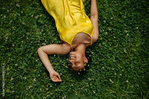  Black Woman Laying Down In The Grass. photo