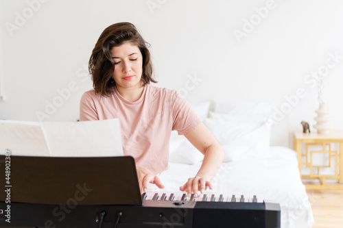 Pianist playing at home photo