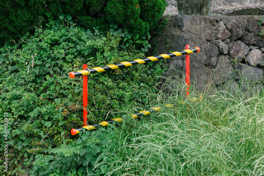 a stick with red and yellow stripes a stick with red and yellow stripes