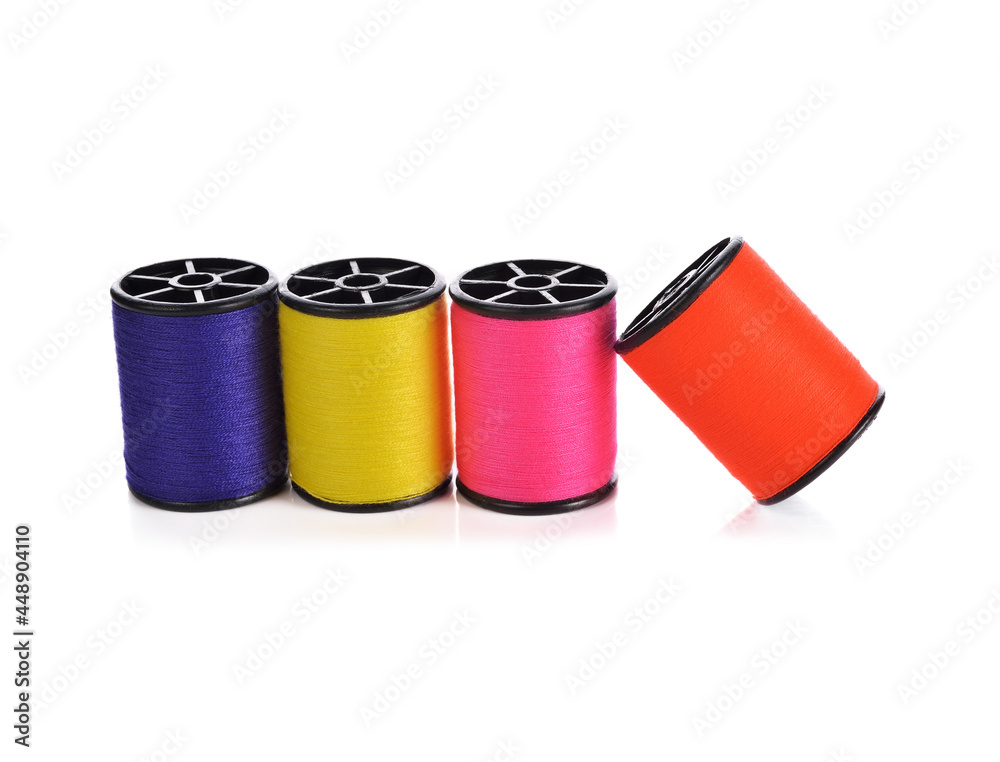 Colourful thread spools isolated on a white background. Colourful thread spools isolated on a white background.