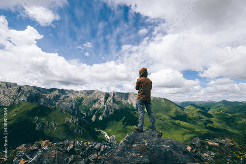 Hiker on high altitude mountain top