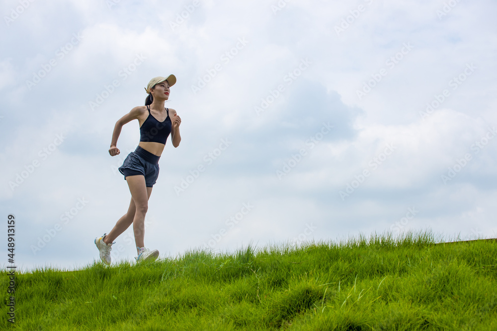 Young Asian girls running in the morning for fitness