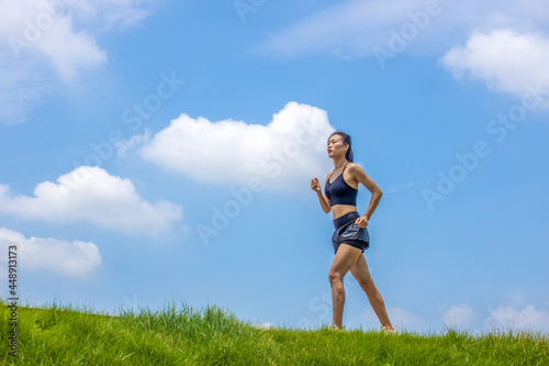 Young Asian girls running in the morning for fitness