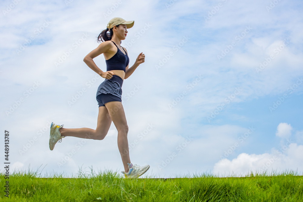 Young Asian girls running in the morning for fitness Young Asian girls running in the morning for fitness