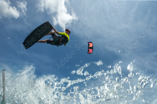 A kite surfer rides the waves