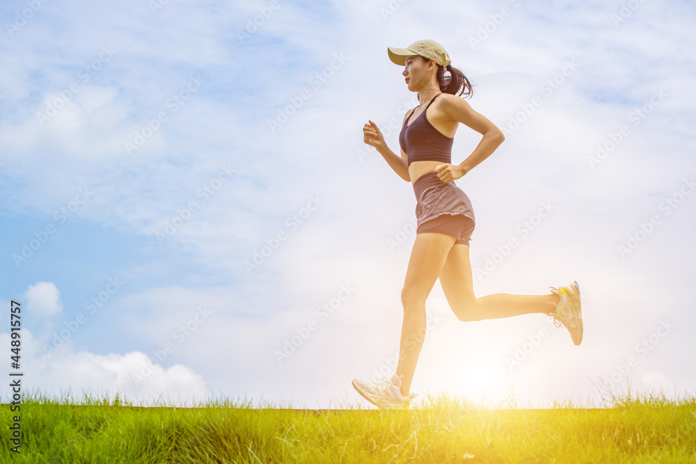 Young Asian girls running in the morning for fitness Young Asian girls running in the morning for fitness